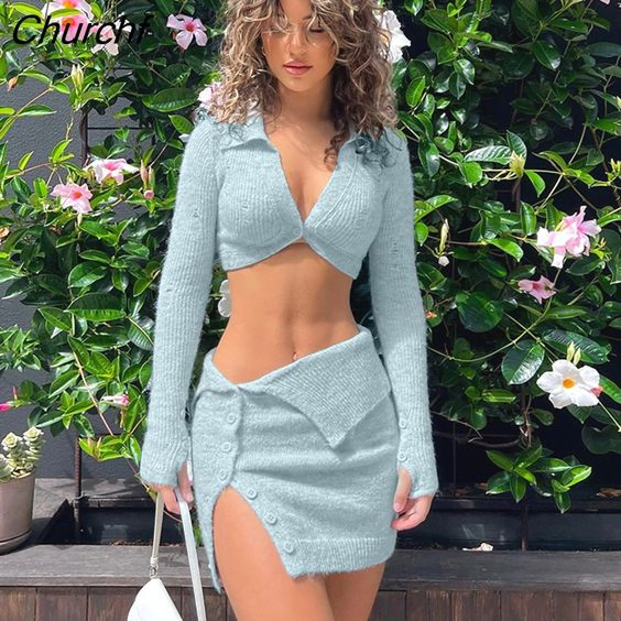 A long sleeve crop top and a mini skirt